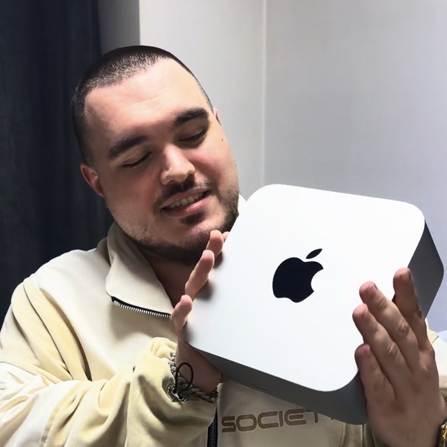 Robert Seghedi holding a Mac mini